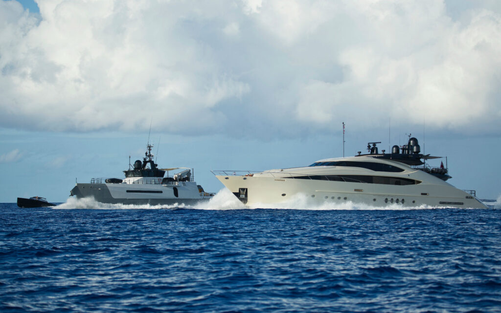 Motor yacht VANTAGe cruising with her support yacht AD-VANTAGE