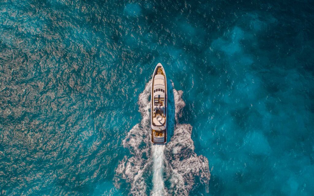 Aerial view of yacht cruising