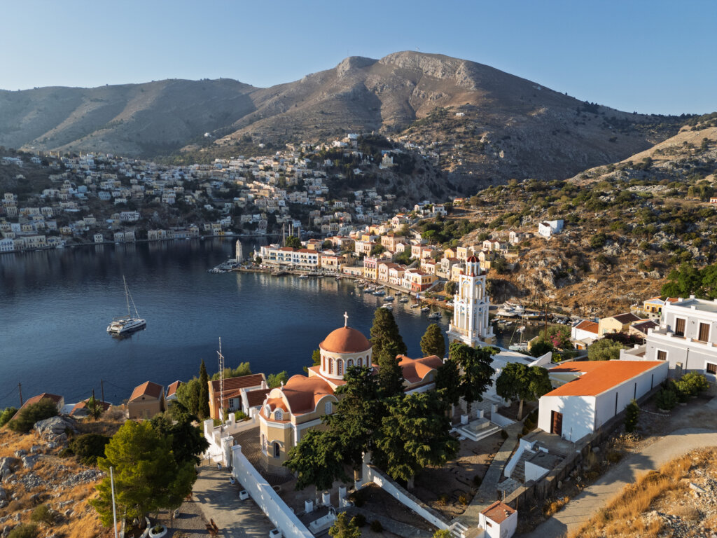 Aerial view of village and coastline, Symi Town, Symi, Greece